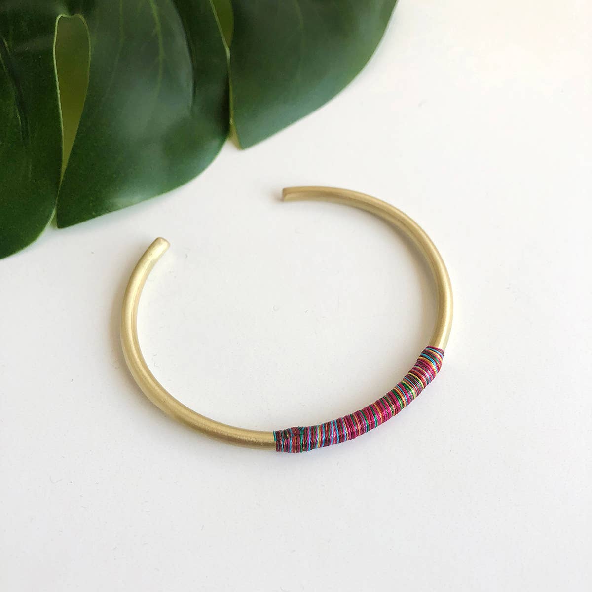 Ribbon wrapped brass bracelet